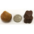 A chocolate selection featuring a shell-shaped chocolate and two heart-shaped chocolates, with a ten-cent coin for scale.