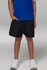 Black sports shorts for kids, featuring a relaxed fit and an elastic waistband, paired with a blue shirt.