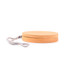 A circular bamboo cable organizer with a textured surface and a grey strap for easy carrying.