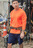 An orange long sleeve safety tee is worn by a man with a tool belt, set against a cluttered worksite background.