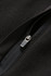 A close-up of a black polar fleece half zip top featuring a zipper and soft fabric texture.