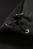 A close-up of a black polar fleece half zip top, featuring a drawstring and fabric detail.