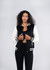 A black and white women's varsity jacket made from a soft wool blend, featuring a logo and striped detailing.