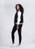 A black and white women's varsity jacket with a soft shell wool blend, modelled alongside black leggings and white shoes.