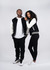 A black and white wool blend varsity jacket worn by a man and a woman, featuring a logo. Both models are in casual attire.