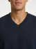 A navy V-neck fleece jumper with a relaxed fit, featuring a subtle logo on the chest.