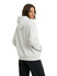 A light grey oversized hoodie with a hood and side pockets, featuring a logo on the front.