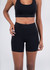 High rise legging shorts in black, featuring a smooth waistband and a fitted design. Includes a logo.