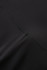 A close-up of black high rise legging shorts, featuring smooth fabric and visible stitching details.