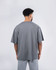 A grey unisex oversized easy-fit tee featuring a simple design and a plain back view.