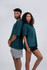A teal unisex oversize easyfit tee displayed on two models, one male and one female, against a neutral background.
