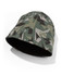 A green and grey camo patterned knitted beanie with a smooth inner lining and a logo.