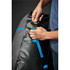 A person adjusts a blue strap on a black and grey Kemano Backpack, featuring a logo and a 40-litre capacity.