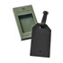 A black luggage tag with a textured surface, packaged in a green box, featuring a logo.