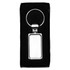 A silver metal keyring with a rectangular pendant, packaged in a black box.