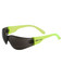 A pair of sunglasses featuring a black lens and vibrant green frames, with a logo on the side.