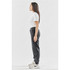 A side view of women's grey fleece jogger pants, featuring a relaxed fit and an elastic waistband.