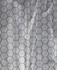 A textured fabric featuring a hexagonal pattern in black and grey, typical for outdoor vests.