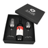 A wine box featuring a bottle of Shiraz and two stemmed glasses, all presented in a black gift box with a logo.
