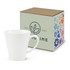 A white latte coffee mug next to a decorated packaging box featuring floral designs and a logo.