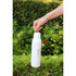 A drink bottle in white with a metal loop, designed for easy carrying, set against greenery.