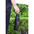 A drink bottle in matte black with a metal loop, featuring a logo and a 600ml capacity.