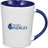 A ceramic coffee mug with a white body and a blue handle and rim, featuring a logo on the front.