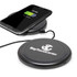 A wireless charger in black with a smartphone on top, displaying a charging screen, and a visible logo.