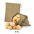 A large jute produce bag in beige, filled with fresh potatoes, with an empty bag beside it.