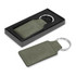 An olive green key ring presented in a black packaging box. It features a metal ring and a rectangular leatherette tag.