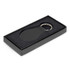 A round leather key ring in a black gift box with a soft interior. The key ring features a silver metal ring.
