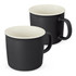 A drinkware set featuring two black coffee mugs with a contrasting white interior and a handle. Each mug has a smooth finish.