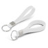 A white silicone key ring featuring a debossed design and a metal keyring attachment.