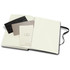 A large hard cover notebook with an elastic closure, featuring blank pages and decorative sheets inside.