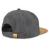 A grey flat peak cap with a cork peak and a metal buckle adjustment on the back. Features a logo on the side.
