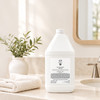 Zents Earth Lotion 1 gallon bottle on bathroom counter
