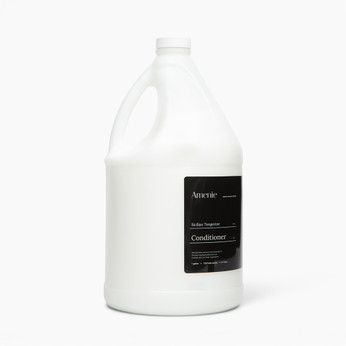 Amenie Sicilian Tangerine Conditioner gallon-size container shown at an angle on a plain white backdrop