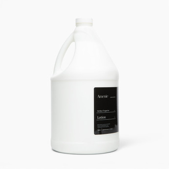 Amenie Sicilian Tangerine Lotion gallon bottle positioned at an angle with clean white background