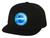 Black flat-brim hat featuring a vibrant blue circular patch with a sailfish and 'Drop A Line' logo on the front—ideal for offshore fishing and big game anglers