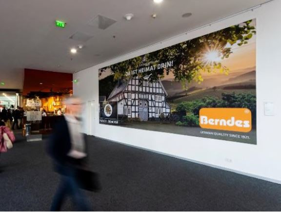 Banner in the foyer of Hall 4.1 near the café/bar