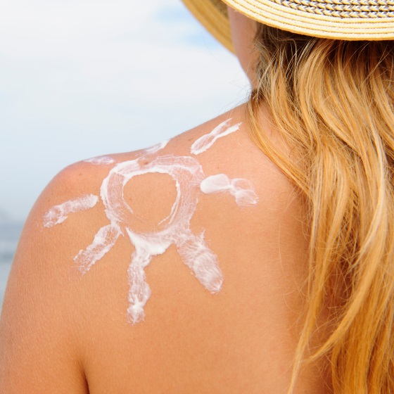 woman-with-sunscreen-on-shoulder.jpg