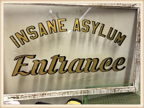 Inside Asylum Entrance Sign