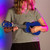 Lifestyle image of the Mad About Blue Left-Handed soprano ukulele being played. Lightweight beginner ukulele with carbon strings, geared tuning pegs and a compact 21-inch design, ideal for left-handed children, students and first-time players learning chords, strumming and basic techniques.