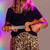 Lifestyle image of the Mad About Natural Wood Left-Handed soprano ukulele being played. Lightweight beginner ukulele with carbon strings, geared tuning pegs and a compact 21-inch design, ideal for left-handed children, students and first-time players learning chords, strumming and basic techniques.
