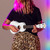 Lifestyle image of the Mad About White soprano ukulele being played. Lightweight beginner ukulele with carbon strings, geared tuning pegs and a compact 21-inch design, ideal for children, students and first-time players.