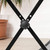 Front view of Tiger X-frame keyboard stand centre joint, black steel crossed legs with  adjustment knob.