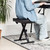 Tiger adjustable padded keyboard bench in use, black padded seat with X-frame base positioned at a keyboard.