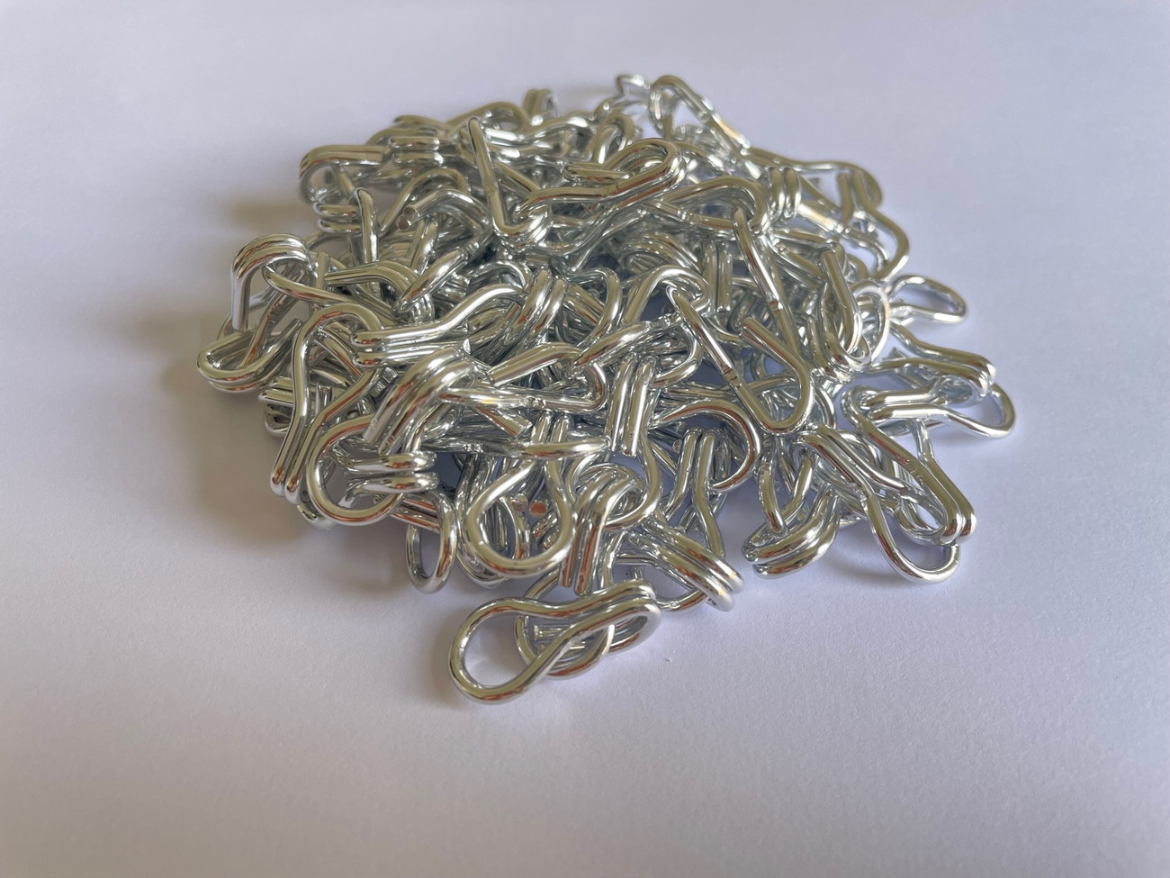 Silver Aluminium Chain. Silver is our most popular colour here at Sway Screens and can be used in domestic or commercial settings to create a chain screen for pest control or designs. This purchase by the metre chain is used for repairing or replacing strands on an older screen or to create patterns or stripes. We can supplie replacement chain by the metre or if you need chain for a larger project we can supply in 600m boxes.