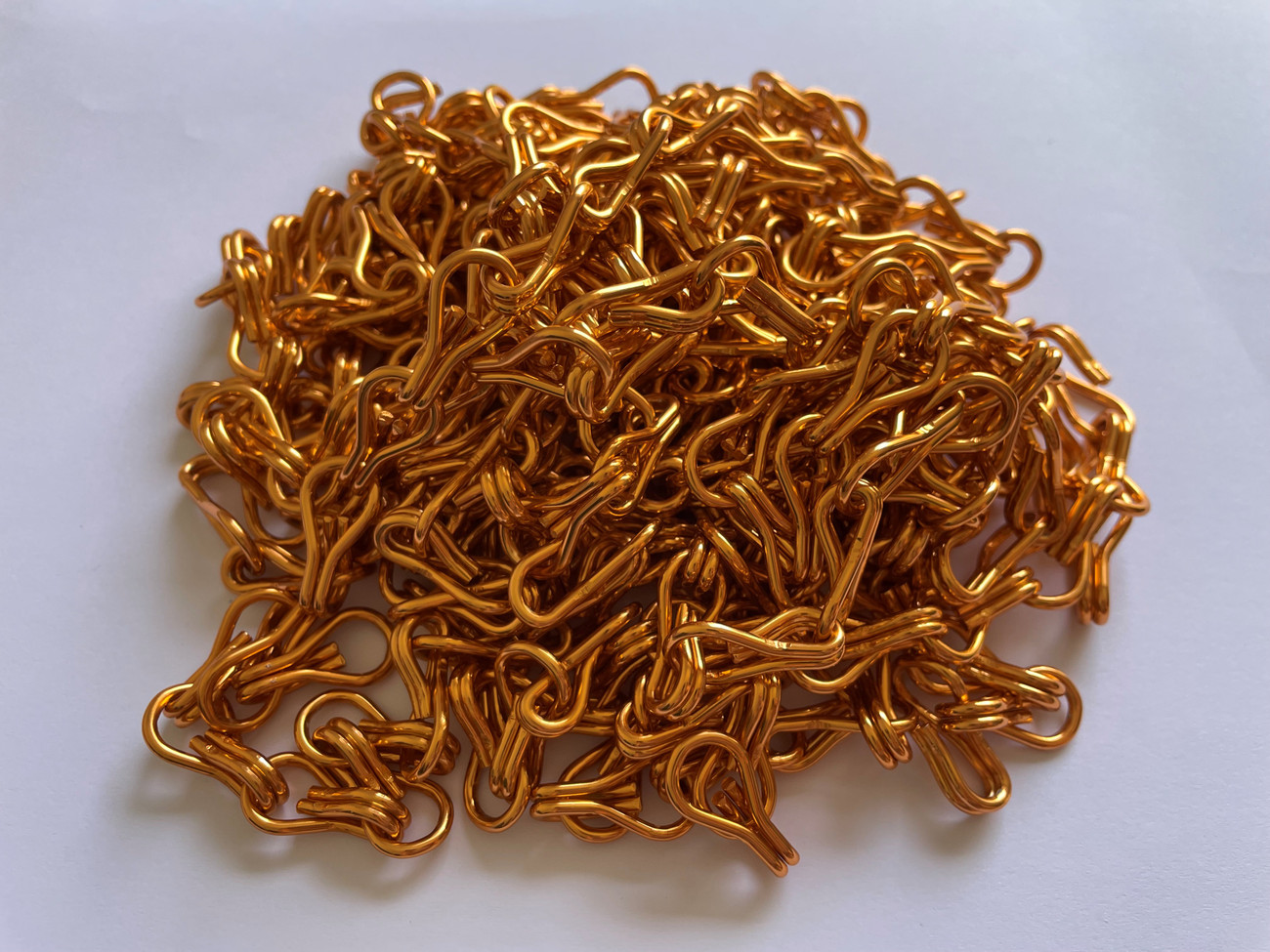 Orange Gold Premium Aluminium Chain. Sway screens are an exclusive supplier of this colour in the UK. This chain can be used to create your own chain screen or to repair or replace strands on an older screen. The screens are used in pest control to stop flies, bugs and insects entering your kitchen, living areas or your business.