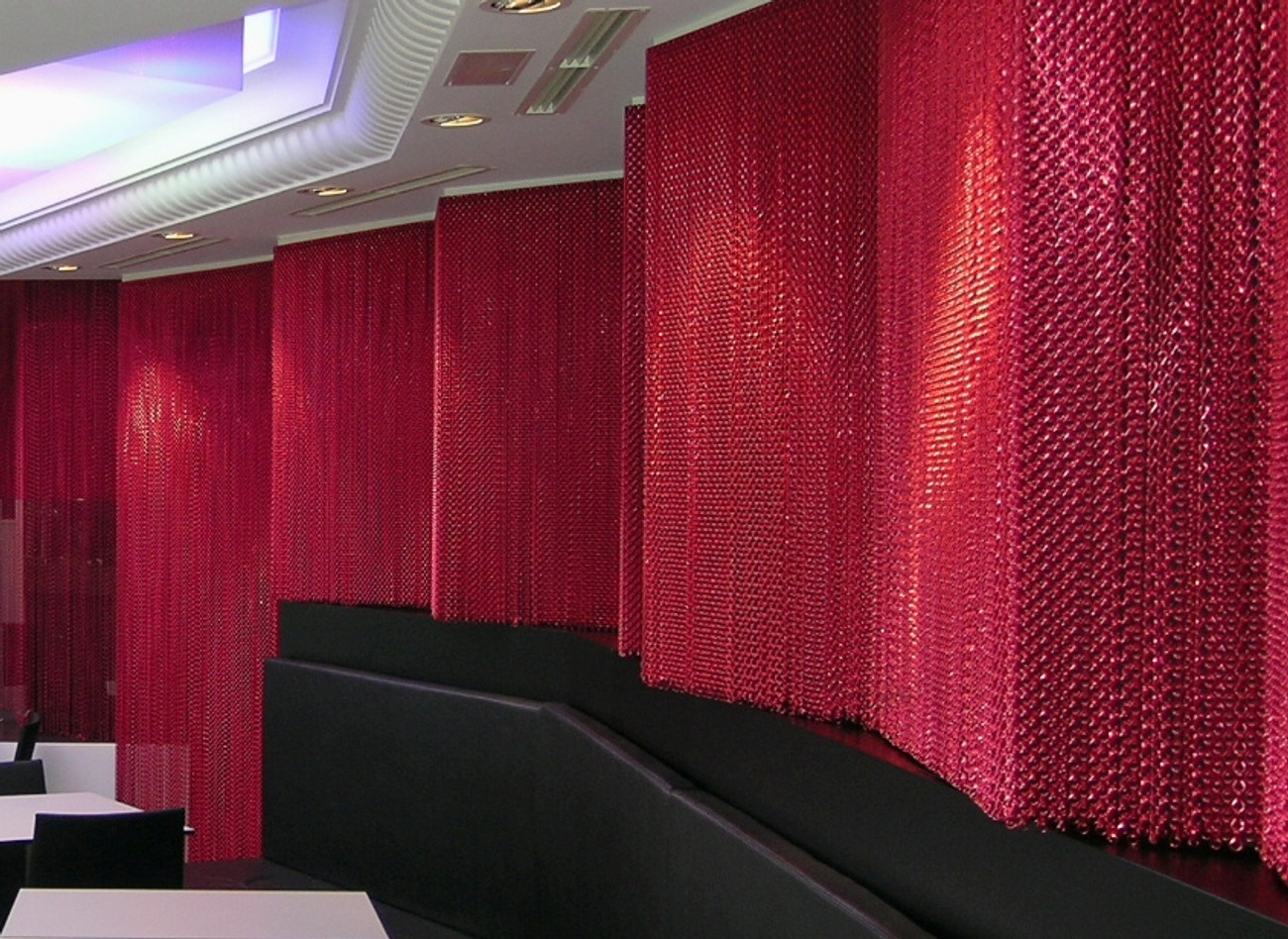 Flexi rail was used to create a stunning metallic red screen to separate areas in a restaurant. Fully custom made to meet the specification of the client.